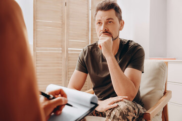 Wall Mural - Psychologist working with military officer in office