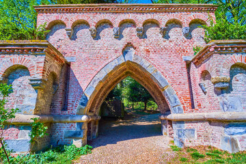 Wall Mural - The medeival brick arched Neo-Gothic portal in Monza Royal Gardens (Giardini Reali di Monza), Italy