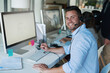 © AS/peopleimages.com - Putting a positive spin on his calls. Portrait of a happy and confident young man working in a call center.