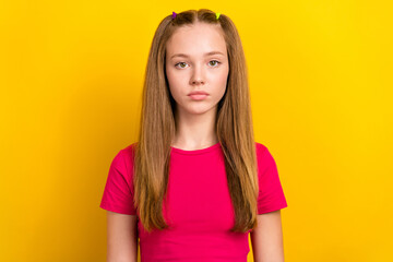 Sticker - Photo of serious confident schoolgirl with straight hairstyle wear pink t-shirt looking at camera isolated on yellow color background