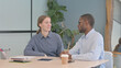 © stockbakers - Young Business People Talking in Office