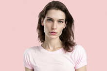 Generated AI Portrait Of Confident Young Brunette In White Casual Shirt Looking At Camera Against Pink Background