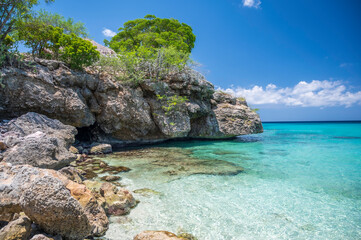 Wall Mural - The crystal clear, turquoise ocean, at Grote Knip beach, on the Dutch Caribbean island of Curacao, famous for it's blue water