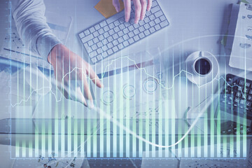 Poster - Multi exposure of man's hands typing over computer keyboard and forex graph hologram drawing. Top view. Financial markets concept.