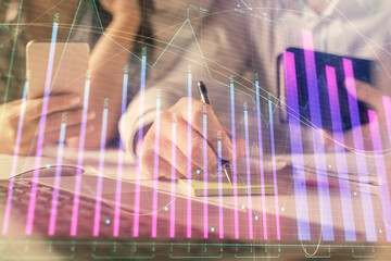 Aufkleber - Double exposure of man and woman working together and financial graph hologram. Business concept. Computer background.