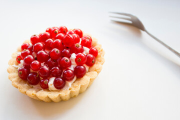 Wall Mural - Tartlet with currants. Dessert with red fruits such as raspberries, strawberries, blackberries or blueberries.