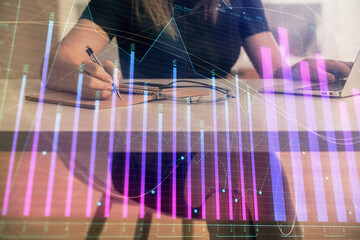 Aufkleber - Double exposure of businesswoman hands typing on computer and forex chart hologram drawing. Financial analysis concept.