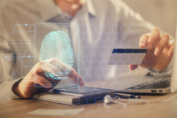 Aufkleber - Double exposure of man hands holding a credit card and fingerprint drawing. Security in E-commerce concept.