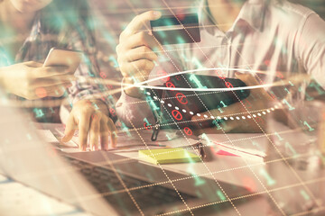 Aufkleber - Double exposure of man and woman on-line shopping holding a credit card and forex graph hologram drawing. Stock market E-commerce pay on-line concept.