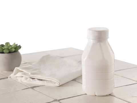 Fototapete - Plastic bottle of milk on isolated background