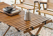 © xiaoliangge - stainless steel kettle, chair,portable gas stove, bowl and vintage lanterns on outdoor wooden table in camping area
