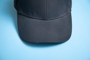 Wall Mural - Baseball cap on the blue background.