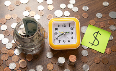 Wall Mural - Alarm clock and coins. Business