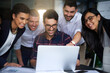 © Lucinda D B/peopleimages.com - This is some really impressive work. Shot of a group of colleagues working together around a laptop in an office.