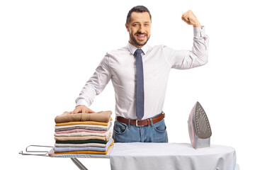 Sticker - Young man with an iron and a pile of clothes showing arm muscle