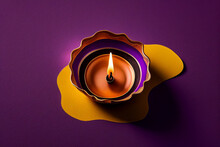 Happy Diwali - Clay Diya Lamps Lit During Diwali, Hindu Festival Of Lights Celebration. Colorful Traditional Oil Lamp Diya On Purple Background	