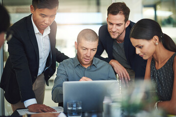 Aufkleber - Working on their combined strategy. Shot of a group of businesspeople meeting in the boardroom.