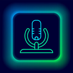Poster - Glowing neon line Microphone icon isolated on black background. On air radio mic microphone. Speaker sign. Colorful outline concept. Vector