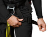 © MM - The man tightens the strap on his leg. Insurance system. For work at height. industrial mountaineering, tourism, height. Iolated