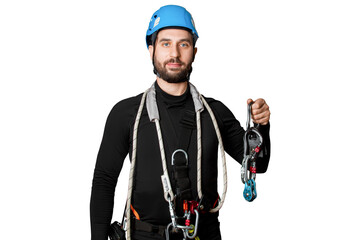 Wall Mural - A man in a belay system for work at height. Carabiners, straps, safety ropes. Industrial mountaineering, power generators, towers. High-altitude work. insurance. isolated