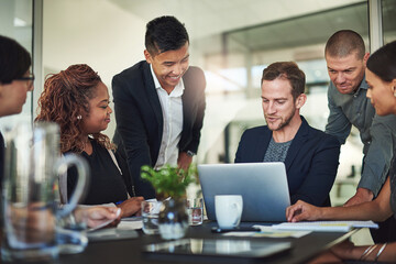 Aufkleber - Impressive. Shot of a group of businesspeople meeting in the boardroom.