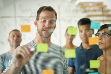 Aufkleber - Planning is the first step. Cropped shot of a group of young designers planning on a glass board.