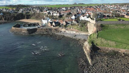 Wall Mural - Crail, a historic fishing village on the east coast of Scotland in the East Neuk of Fife. Low level aerial footage of the pretty little harbour. 