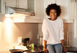 © Lyndon S/peopleimages.com - Cook, eat and be happy. Portrait of a happy young woman sitting on her kitchen counter.