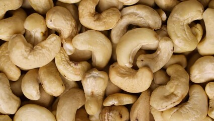 Wall Mural - Cashew nuts as a background, top view. Cashew isolated on white background. Healthy foods.