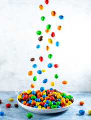 Wall Mural - Multi-colored round candies in colored glaze in large quantities in a plate