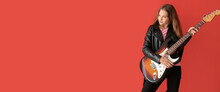 Teenage Girl Playing Guitar Against Red Background With Space For Text