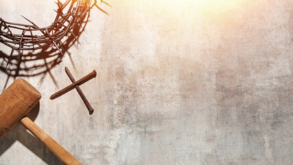 Crown of thorns, cross and mallet on grunge background with space for text. Good Friday concept