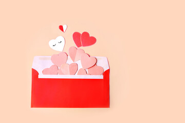 Wall Mural - red envelope with pink and red hearts.