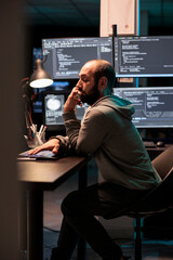 Poster - it engineer answering landline phone call in office, talking about coding html script on cord teleph