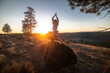 Beautiful young woman practice yoga at sunset time on nature outdoors. Healthy lifestyle concept.