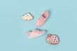 Sports shoes, pink sneakers and cute gingerbread on background. Summer time concept. Top view Flat lay