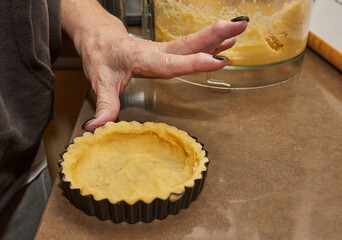 Wall Mural - Process of making the base for Round Cream Pie with Chocolate and Strawberries. French recipe