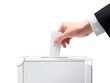 選挙_投票する_国民投票のイメージ素材｜投票箱に投票用紙を入れる手