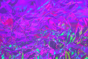 abstract holographic background in 80s, 90s style. modern bright neon colored crumpled metallic psyc