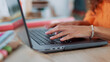 © Kirsten D/peopleimages.com - Hands, typing and laptop with a black woman designer working in her office on a report or online order. Ecommerce, computer and creative with a young female freelance blogger at work on an article