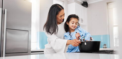 Wall Mural - Cooking, learning and happy with mother and daughter in kitchen for food, bonding and meal preparation. Smile, health and nutrition with woman and girl in family home for teaching, diet and skills