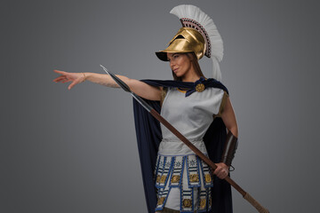 Wall Mural - Shot of ancient female warlord from greece dressed in light armor and cloak.