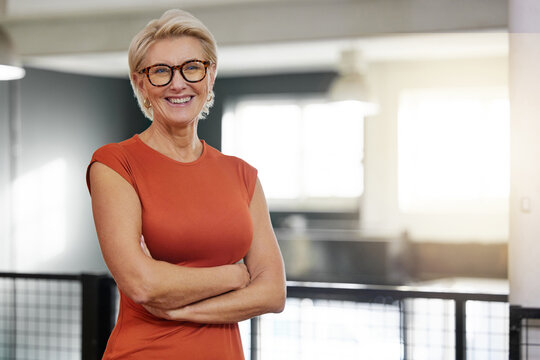 portrait, arms crossed and smile of business woman in office with pride for career and job. ceo glas