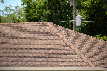 Wall Mural - Closeup of house roof top covered with asphalt or bitumen shingles. Waterproofing of new building