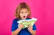 © Olena - Cash money in euro banknotes. Studio portrait of child with euro money banknotes. Kid with money for future. Children learning financial responsibility about saving money.