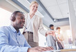 © Lune V A/peopleimages.com - Manager woman, call center and computer desk for support, advice or help with telemarketing sales. Black man consultant or agent with mentor for CRM, customer service or contact us consultation