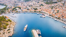 Croatia's Harbor Is A Sight To Behold From Above. This Breathtaking Aerial View Captures The Colorful Landscape Filled With Sailboats, Motorboats, And Luxurious Yachts Resting In A Clear Blue Bay. Add