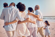 © Jesse Bettencourt/peopleimages.com - Big family hug, love and beach walking, bonding or enjoy quality time together for vacation, holiday peace or freedom. Ocean sea, summer travel and back view of relax people in Rio de Janeiro