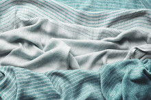 Background With Draped Blue Gray Cotton Fabric, Napkin, Striped Tablecloth Or Scarf