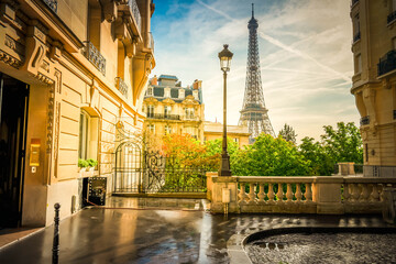 Wall Mural - cosy paris street with view on the famous eiffel tower on a cloudy summer day, paris france, retro t